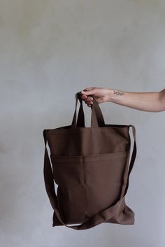 This classic tote bag now has two front pockets and a shoulder strap to carry the bag over the shoulder. This bag is very practical for keeping your essentials close at hand in addition to being able to carry all your belongings. Perfect for school or for your everyday life! Details:15" x 3" x 17"39" Straps100% CottonEspresso By Dans Le Sac Classic Tote Bag, Crossbody Tote Bag, Crossbody Tote, Everyday Life, Espresso, Shoulder Strap, Tote Bag