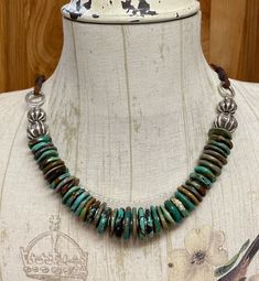 "* Welcome to FoxSparrowOOAKDesign! * This listing is for one turquoise and Karen Hill Tribe necklace handcrafted by me in my smoke free home studio. * Hubei Turquoise. * Beautiful shades of greens and browns. * The beads are graduated from 15mm to 20mm. * Karen Hill Tribe silver findings. * Substantial length of 25\". * The center section measures 10\". * Secured with soft leather ties and a hand forged hook clasp. * Ready to ship and securely bubble wrapped. * Thank you for supporting handmade Adjustable Green Rustic Necklace, Adjustable Rustic Green Necklace, Adjustable Southwestern Green Turquoise Necklace, Artisan Brown Turquoise Necklace Hand-strung, Artisan Green Turquoise Necklace With Patina, Artisan Brown Turquoise Necklace For Jewelry Making, Rustic Green Jewelry With Patina, Adjustable Artisan Turquoise Round Necklace, Artisan Adjustable Turquoise Necklace