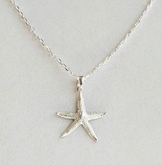 "Sterling Silver Starfish Pendant". Hammered 925 Sterling Silver Starfish measures 1 x 1". Gorgeous Sterling Silver Diamond Cut Cable Chain, Sterling Silver Bail (hanger) and 925 Sterling Silver Lobster Claw Clasp included. Other Chain lengths or Clasps upon request. Gorgeous Starfish replica you will cherish for a lifetime!!! Silver Starfish Charm Pendant Jewelry, Sterling Silver Starfish Charm Pendant Necklace, Sterling Silver Pendant Necklace With Starfish Charm, Star-shaped Sterling Silver Jewelry With Lobster Clasp, Silver Starfish Jewelry For Gifting, Silver Starfish Jewelry As Gift, Silver Starfish Jewelry For Gifts, Silver Starfish-shaped Jewelry Gift, White Gold Sterling Silver Starfish Jewelry