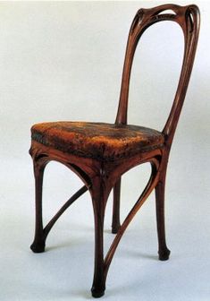 a wooden chair sitting on top of a white floor