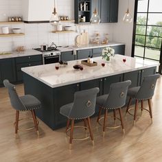 a large kitchen with an island in the middle and four chairs at the counter top