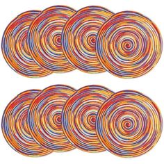 six circular coasters with different colored circles on the bottom and one in the middle