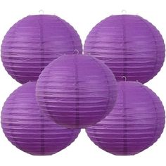 four purple paper lanterns hanging from the ceiling