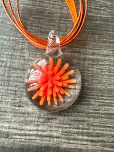 This necklace is made with a 3D orange flower pendant. *Each pendant has the same colors but the design might vary slightly. Note: Colors may vary depending on your monitor  I do have other colors for the necklace strands for both multi and single strand.  If you are looking for a different variation, feel free to touch base with me and I can let you know if I have what you are looking for. Shipping Info: All orders are shipped from Canada and they are sent through Canada Post.  If you would lik Flower Pendant Necklace, Glass Pendant Necklace, Orange Flower, Canada Post, Orange Flowers, Flower Pendant, Glass Pendants, Other Colors, Necklace Etsy