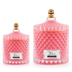 two pink glass jars with gold trimmings on the top and bottom, one is empty