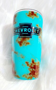 an old blue can with rust on it