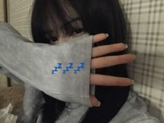 a woman covering her face with a piece of cloth over her head and the word'i love you'written on it