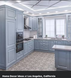 a large kitchen with blue cabinets and white counter tops is featured in this postcard