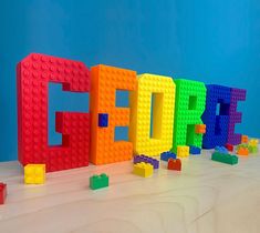 colorful lego letters spelling out the word core in front of a blue background with blocks