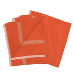 three orange napkins on top of each other