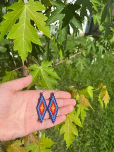 Native-made beaded earrings (Cherokee). They are named Alisaladisgv, which means rising in Cherokee. These are hand-woven with Fireline thread using high quality 11/0 miyuki round seed beads on silver plated hooks. These earrings are lightweight and work for sensitive ears. Please message me if you have any questions! I have been developing my beadwork for over three years now, and you can view more of my work at @willow.beads_ on Instagram  I can also do custom orders (: Artisan Hand-strung Beaded Earrings, Handwoven Teardrop Jewelry As Gift, Artisan Hand-strung Earrings For Gift, Adjustable Hand-strung Beaded Earrings As Gift, Artisan Hand-strung Dangle Earrings, Artisan Hand-strung Round Bead Earrings, Southwestern Style Beaded Earrings With Ear Wire As Gift, Handwoven Teardrop Earrings For Festivals, Traditional Hand-strung Earrings For Gifts