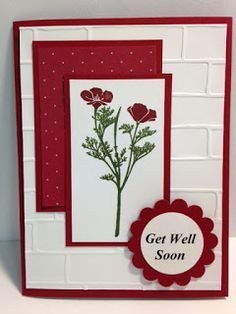 a handmade card with red flowers on it