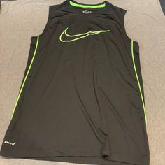 Nwot Nike Dri-Fit Jersey/Tank Top Boys Size Xl Black With Neon Green Swoosh Nike Sporty Sleeveless Vest, Green Sleeveless Sportswear Top, Nike Sleeveless Sports Vest, Nike Sleeveless Tops For Sports Events, Nike Casual Sleeveless Vest, Casual Nike Sleeveless Vest, Green Sporty Tank Vest, Sporty Sleeveless T-shirt For Sports Season, Sporty Green Tank Vest