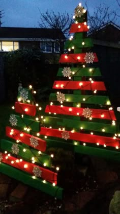 a christmas tree made out of wooden planks