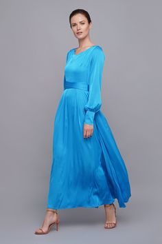 "A long sky blue dress featuring a flowing pleated skirt, long sleeves with cuffs, and a v-neckline. - Maxi length - A line silhouette - Long puffy sleeves with cuffs - V neckline - Belted - Concealed side zipper closure - Lined Color: sky blue Fiber: viscose 35%, polyester 60%, elastane 5% Lining: 95% viscose, 5 % elastane For Size S (6 US): dress length - 53\" (135 cm) Our model wears size S (06) and is 176cm/5'8\" tall. You may feel free choosing the size. Just send us your measurements (bust Blue V-neck Silk Dress For Formal Occasions, Modest V-neck Formal Dress, Flowy Long Sleeve Dress With Gathered Sleeves, Blue V-neck Dress With Pleated Bodice, Formal Long Sleeve Pleated Evening Dress, Formal Maxi Dress With Gathered Sleeves, Wedding Dress With Pleated Back And Long Sleeves, Modest Maxi Dresses With Gathered Sleeves, Long Sleeve Evening Dress For Spring Bridesmaid