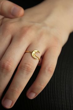 Dainty Moon Ring, delicate moon ring, Crescent Moon Ring, Celestial ring This dreamy moon ring is the perfect add to your Selene collection of stackers. These little engraved details on the moon make it come to life through stardust. Wear it everyday, everywhere. - Hand crafted in sterling silver, 22 Κ gold plating. - Band thickness: 1.6 mm. - Moon diameter: 11.4 mm x 9 mm. ♥ You can wear this jewel with this pair of hoop earrings:  https://www.etsy.com/listing/833952905/crescent-moon-earrings-h Minimalist Crescent Moon Charm Ring, Dainty Jewelry Open Ring With Moon Phase, Dainty Moon Phase Open Ring Jewelry, Elegant Crescent Moon Charm Rings, Adjustable Moon Shaped Promise Ring, Celestial Moon Midi Rings As Promise Ring, Minimalist Rings With Moon Charm For Gifts, Dainty Adjustable Ring With Moon Charm, Dainty Moon Charm Ring