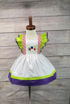 "\"Elevate your style with our Buzz Light-inspired dress! Handcrafted with love using soft cotton, this dress is perfect for birthdays, vacation photos, and special moments. Embrace the magic of Buzz Lightyear and create unforgettable memories in this unique cotton creation. Ideal for adding a touch of whimsy to any occasion, our handmade dress ensures you stand out with comfort and style. Make every moment special with our Buzz Light dress crafted from quality cotton materials" Buzz Light Year Costume, Buzz Lightyear Costume, Toy Story Land, Space Ranger, Toy Story Birthday, Light Dress, Handmade Dress, Light Year, Vacation Photos