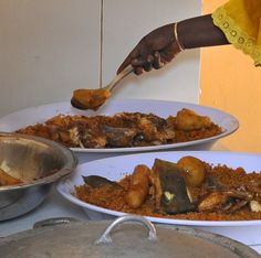 two plates with food on them being served