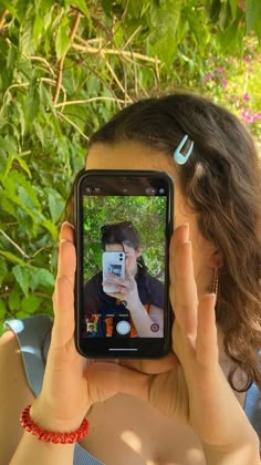 a woman taking a photo with her cell phone