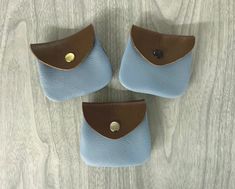 These sky blue / brown two tone small coin purses are made of genuine cowhide leather, they may be small but it's handy to put in your front or back pocket to carry small change for parking meters, cones, trinkets, some even use for ear buds, rosaries, jewelry, etc.  black, silver, or gold color metal snap Snaps easy .  I put a rivet on each side toward top to strengthen, along with stitching.    Measures from outside about 2-3/4" wide toward bottom, 2-3/8" at opening, x 2 1/2" high closed. Blue Zipper Coin Purse As Gift, Blue Coin Purse With Card Slots For Gift, Blue Bags With Coin Pocket For Gifts, Blue Coin Purse With Removable Pouch, Compact Blue Coin Purse For Everyday Use, Blue Bag With Coin Pocket For Daily Use, Blue Coin Purse With Card Slots For Personal Use, Blue Coin Purse With Removable Pouch For Everyday, Blue Coin Purse With Card Slots