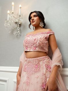 Farah Lehenga is a beautiful ensemble in an eternal blush pink, elevating the bride's attire. The scrupulous embroidery and glint of mirrors and resplendent pearls and glittering stone make it classy and sumptuous. Stitched with soft net fabric, it is inclusive of embroidered dupatta and blouse and lehenga that gives an ultimate, refined and royal look to the bride-to-be at her special occasion. Ideal for weddings and other exclusive events. Key Features: Color: Blush Pink Fabric: Soft net Embel Buy Lehenga Online, Indian Bridal Couture, Reception Gowns, Elegant Veils, Mehendi Outfits, Bride Attire, Lehenga Online, Buy Sarees Online, Bridal Lehenga Red