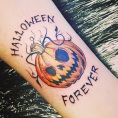 a tattoo that says halloween is forever on the arm with a jack - o'- lantern