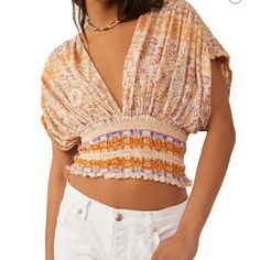 Fanciful Boho Dreams Feature Tops Just Like This, With Elastic Smocking That Emphasizes The Billowy Bodice With Alluringly Deep Front And Back V-Necklines. 17" Length (Size Medium) Ties At Back Deep V-Neck Elbow-Length Sleeves 62% Cotton, 38% Modal Machine Wash, Tumble Dry Layered Crop Top, Vacation Tops, Free People Blouse, Puff Sleeve Crop Top, Ruffle Crop Top, Bohemian Tops, Bralette Crop Top, Cold Shoulder Long Sleeve, Summer Crop Tops