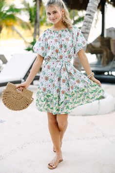 This floral dress is so cute and easy to wear! It's the perfect combination of classy and casual. Which means you can dress this beauty up with heels or down with sandals. Round neckline Short sleeves Tied waist Dual floral print No stretch Poppy is wearing the small. Mint Julep Boutique, White Floral Dress, Mint Julep, Model Fits, Personal Marketing, Dress Accessories, Round Neckline, Floral Dress, Poppies