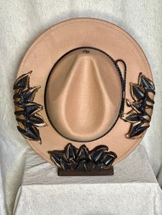 This one of a kind, hand painted, textured floral fedora is the perfect walking art piece. Each hat is uniquely crafted and perfect for any occasion.  This tan dragon charmed fedora is crafted with black flowers and gold/bronze metallic accents. These island treasures are shipped straight to you from the Hawaiian island of Oahu. (Hats are water resistant. Keep out of heavy rain. Spot clean only) Artistic Adjustable Hat For Rodeo, Artistic Adjustable Hat Bands For Fedora, Unique Adjustable Fedora For Kentucky Derby, Artistic Short Brim Fedora For Kentucky Derby, Artistic Brimmed Fedora For Kentucky Derby, Artistic Wide Brim Fedora For Kentucky Derby, Hand Painted Adjustable Fedora For Kentucky Derby, Hand Painted Adjustable Wide Brim Fedora, Hand Painted Adjustable Fedora