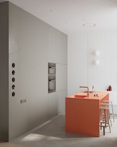 an orange kitchen island in the middle of a room with white walls and flooring