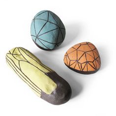 three painted rocks sitting next to each other