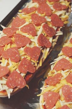 slices of pepperoni and cheese on top of toasted bread