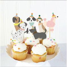 there are cupcakes that have dogs on them