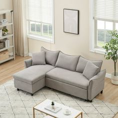 a living room with a sectional couch and coffee table