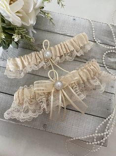 Ivory Lace Wedding Garter, Ivory Garter Set, Wedding Bridal Garter, Garter for Bride, Ivory Garter, Lace Garter Set Beautiful garter in ivory lace and a pearl accent Sale is final, but 100% satisfaction guaranteed. Please contact us if there are any issues with your purchase. Fitted Cream Lace For Wedding Night, Cream Lace For Wedding Night, Cream Lace Wedding Dress For Wedding Night, Cream Lace Wedding Dress For Bride, Elegant Cream Lace For Bride, Fitted Cream Bridal Accessories For Ceremony, Cream Wedding Dress With Delicate Lace, Adjustable Cream Bridal Accessories For Ceremony, Cream Lace Bridal Accessories For Wedding