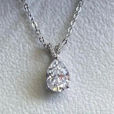 Pear Cut Basket Set Pendant, 14k White Gold Certified Vvs1 Moissanite 2.5 Carat Pear Brilliant Solitaire Solid Gold Necklace au750 9*12mm, 2.5 Carat Pear Moissanite and Shank Moissanite Colorless D VVS1 Clarity Prong setting and Chain 14k White Gold au585.  Measures 16-18 inches Stamped D2.5carat , au585,  Spit hinge is aligned with pave' Moissanite all hand set in 14K White Gold.  Super White Pear-cut Brilliant Moissanite. Ideal Minimalist Necklace Bridal Necklace Gifts for her and gifts for yo White Gold Pendant, Moissanite Necklace, Solid Gold Necklace, Necklace Bridal, Basket Set, Black Card, Super White, Bridal Necklace, Minimalist Necklace