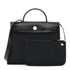 This is an authentic HERMES Military Toile Vache Hunter Herbag Zip PM 31 in Black. This stylish large tote is crafted of sturdy black toile canvas and features a black smooth leather top crest with a leather top handle, shoulder strap, and strap closure with polished palladium silver hardware. This opens to a toile canvas interior and includes a small zippered pouch. Herbag 31, Black Toile, Zippered Pouch, Large Tote, Leather Top, Silver Hardware, Zipper Pouch, Smooth Leather, Top Handle