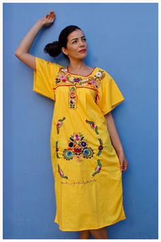 Beautiful dress with colorful floral embroidery, handmade by artisans in Mexico. Each dress is one of a kind in color and fit. May have unique flaws.  Size: M Fabric: Cotton/ Poplin Handmade in Mexico Machine wash delicate cycle, flat line dry, no dryer Traditional Yellow Embroidered Dress For Spring, Yellow Embroidered Dress For Vacation, Traditional Yellow Embroidered Dress With Floral Design, Traditional Yellow Embroidered Dress For Summer, Yellow Floral Embroidered Dress For Spring, Yellow Embroidered Dress With Short Sleeves For Summer, Summer Fiesta Yellow Dress, Yellow Embroidered Hem Dress For Summer, Bohemian Yellow Embroidered Dress With Short Sleeves