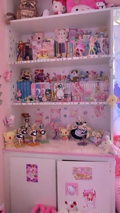 a room filled with lots of toys and stuffed animals on top of white shelving units