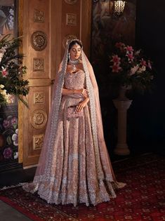 Premium Pakistani Bridal Dress in Pink Lehenga and Choli Style has a perfect balance of style and elegance. This stunning Bridal Lehenga Choli is a trendy masterpiece adorned with Embroidery and hand-crafted details of embellishments, making it an epitome of beauty and grace. Choli Style, Bridal Lehenga Pakistani, Pink Bridal Lehenga, Pakistani Bridal Lehenga, Pakistani Lehenga, Bridal Mehndi Dresses, Pakistani Bridal Dress, Bridesmaid Saree, Pakistani Wedding Dress