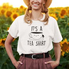 Searching for the perfect gift for your food-loving friend? Look no further! Introducing the "It's A Tea Shirt" by Kooskadoo, the ultimate t-shirt for tea enthusiasts and food lovers alike. With its comfortable unisex Bella-Canvas design, this t-shirt is not only stylish but also perfect for women who enjoy wearing their love for tea on their sleeves. Imagine the joy on their face as they unwrap your thoughtful gift. "It's A Tea Shirt" is a clever play on words that combines fashion and culinary Play On Words, Tea Shirt, Bella Canvas Tees, Canvas Designs, Black Tee, Bella Canvas, Relaxation, Short Sleeves, Perfect Gift