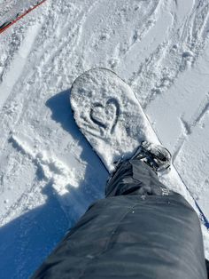 someone is standing on the snow with their feet in the snow