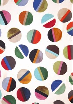 an image of colorful circles on white paper with blue, green, red and yellow stripes