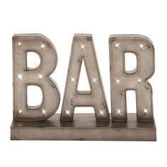 the word bar is lit up with lights on it's sides and sits in front of a white background