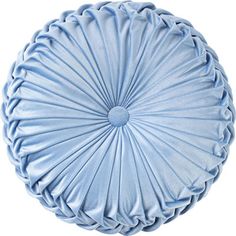 a round blue pillow on a white background