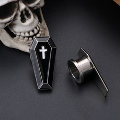 One package includes one pair ear gauge. Gauges: 0g(8mm), 00g(10mm), 7/16''(11mm), 1/2''(12.7mm). Please Choose the Correct Size. Material: 316L Surgical Stainless Steel. Light and comfortable. The trendy coffin design can show your own personality. This ear tunnels is an ideal gift choice on Halloween Day as Halloween Jewelry, Christmas Day, Anniversary Day, Valentine's Day and Birthday to your special one. Let your personality shine through your accessories. You can check out our other listing Gothic Piercings For Halloween Gift, Emo Pierced Jewelry For Halloween, Gothic Plug Earrings For Halloween, Gothic Plug Earrings For Halloween Gift, Gothic Halloween Plug Earrings As A Gift, Black Piercings For Halloween Gift, Gothic Halloween Plug Earrings, Black Earrings For Halloween Cosplay, Black Halloween Cosplay Earrings