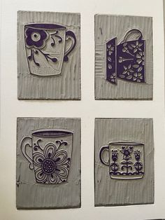 four handmade coasters with coffee cups and flowers on them are displayed in a white frame