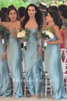 the bridesmaids are all dressed in blue dresses