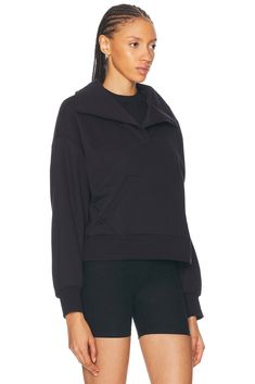 Self 1: 87% cotton 33% polyester, Self 2: 91% cotton 9% elastane.  Made in USA.  Machine wash.  Pull-on styling.  Kangaroo pocket design.  Jersey fabric with fleece lining.  .  .  .  .  .  .  .  .  .  . Sporty Long Sleeve Tops With Side Pockets, Sporty Tops With Side Pockets For Fall, Athleisure Funnel Neck Top With Ribbed Collar, Athleisure Top With Funnel Neck And Ribbed Collar, Athleisure Long Sleeve Top With Side Pockets, Workwear Funnel Neck Top With Ribbed Collar, Long Sleeve Tops With Side Pockets For Athleisure, Workwear Tops With Funnel Neck And Ribbed Collar, Long Sleeve Athleisure Top With Side Pockets