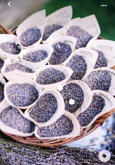 a basket filled with lavender seeds on top of a table